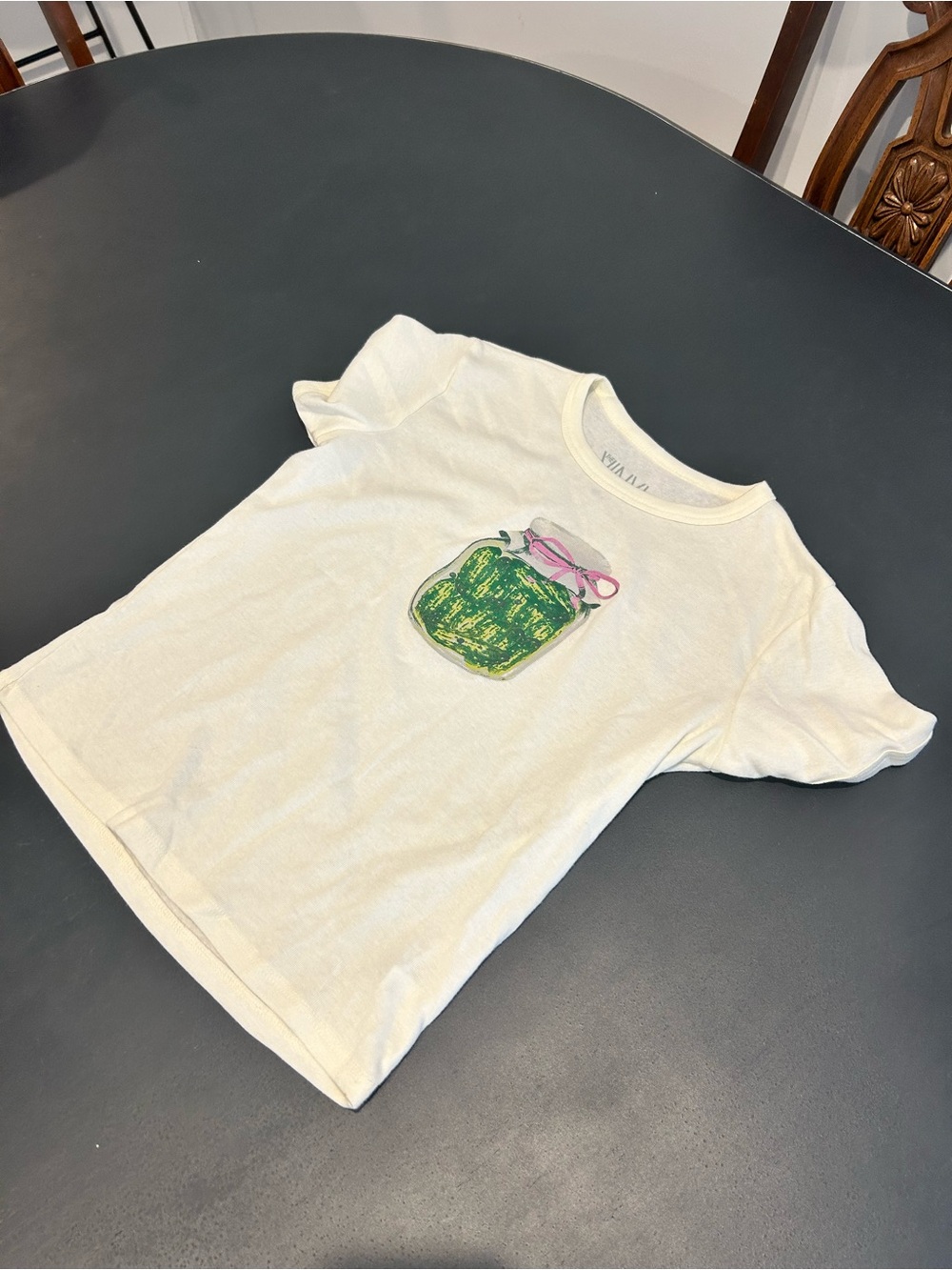 Cream Short Sleeve Tee with Green Jar Graphic and Pink Bow